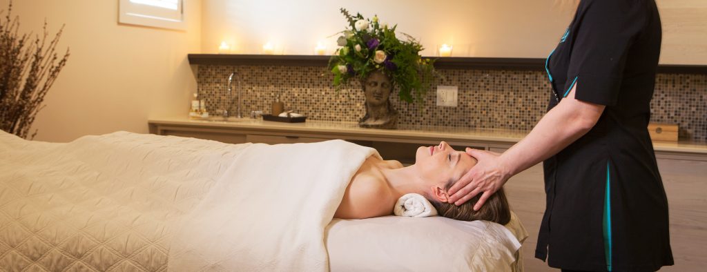 Guest enjoying a facil while laying on massage bed