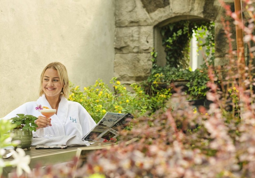 Guest enjoying a drink in the poolside lounge