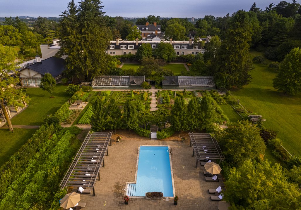 An aerial view of the grounds of Langdon Hall with the pool at centre.