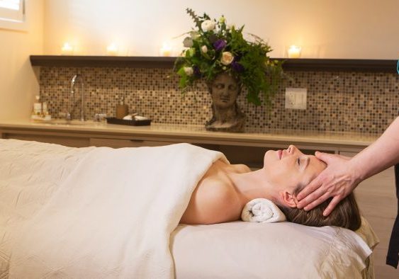 Guest enjoying a facil while laying on massage bed